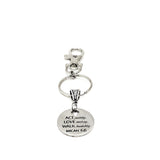 May include: A silver keychain with a round charm that reads &#39;ACT justly, LOVE mercy, WALK humbly, MICAH 6:8&#39;.