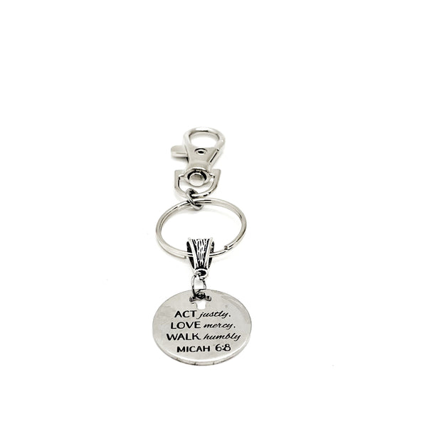May include: A silver keychain with a round charm that reads &#39;ACT justly, LOVE mercy, WALK humbly, MICAH 6:8&#39;.