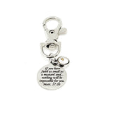 May include: A silver keychain with a round charm that reads &#39;If you have faith as small as a mustard seed... nothing will be impossible for you. Matt. 17:20&#39;.