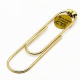 She Is Clothed Goldtone Bookmark Print Font