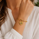 Iron Sharpens Iron Goldtone Cuff Charm Bracelet