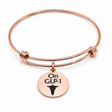 On GLP-1 Rose Goldtone Notice Charm Bracelet